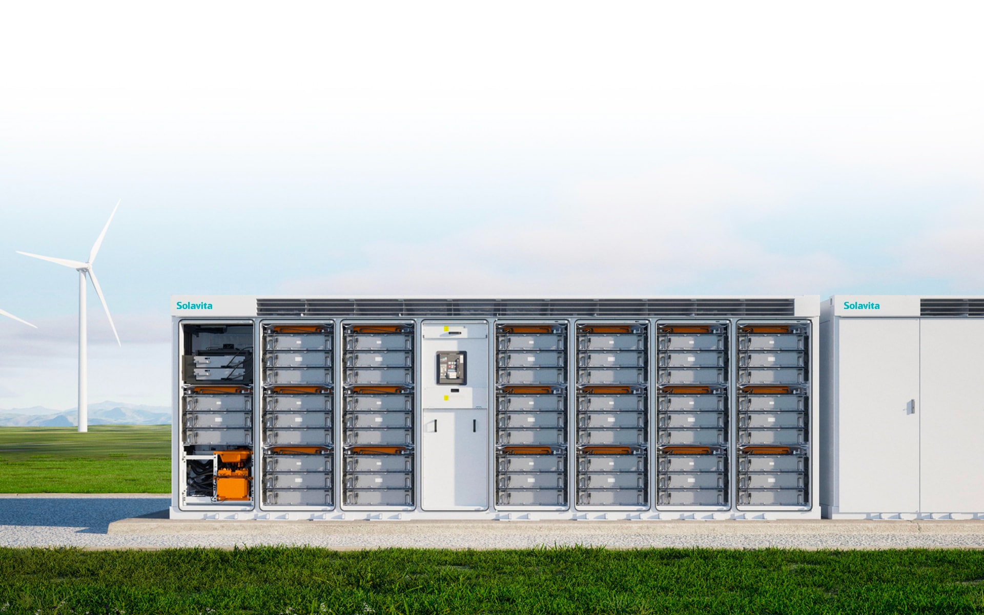 A row of battery storage units with Solavita branding sits outdoors on a concrete platform, seamlessly integrated with the environment. In the background, a grassy field and a distant wind turbine under a cloudy sky evoke endless possibilities