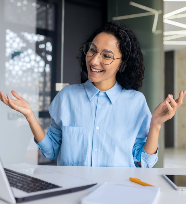 Solavita customer service experts in blue shirts, wearing headphones and smiling as they communicate indoors with customers via video calls, discussing maintenance for Solavita's high-efficiency energy storage inverter solutions, such as the Solavita hybrid inverter