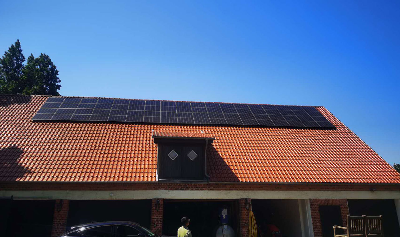 Solar panel array installed on a red-tiled residential roof in Italy, demonstrating Solavita's renewable energy solutions for efficient home energy production.