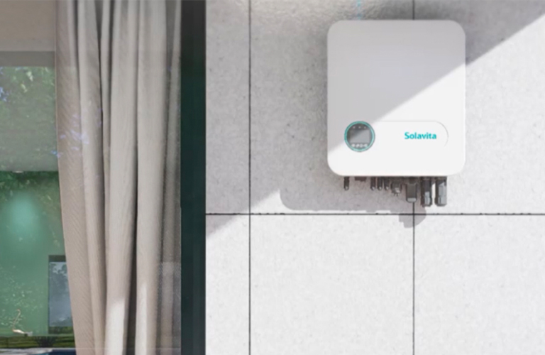 Solavita hybrid inverter mounted on an exterior wall, designed as part of an energy storage system solution for residential applications. The sleek, compact unit features a minimalistic white casing with a discreet interface panel, emphasizing modern design and functionality suitable for seamless integration in home energy systems.