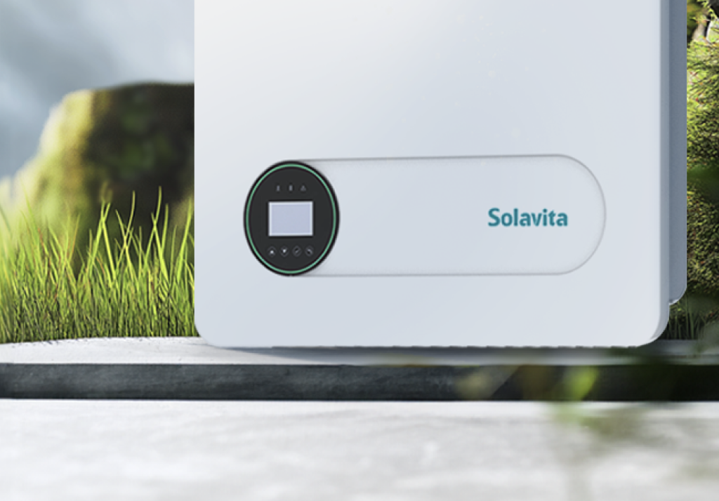 Close-up view of Solavita single-phase 3-6kW hybrid inverter, showcasing its sleek white exterior with a circular black control panel and clear display, mounted outdoors amidst green foliage, emphasizing its compact, durable, and eco-friendly design suitable for residential on-grid energy systems.