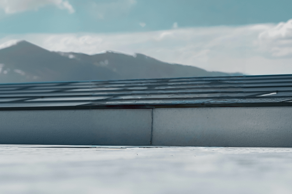 Rooftop view with distant mountains, illustrating the ideal setting for a Solavita residential solution, seamlessly integrating solar panels for sustainable energy